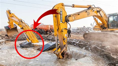 mini excavator stuck in mud|stuck excavator trackhoe buried.